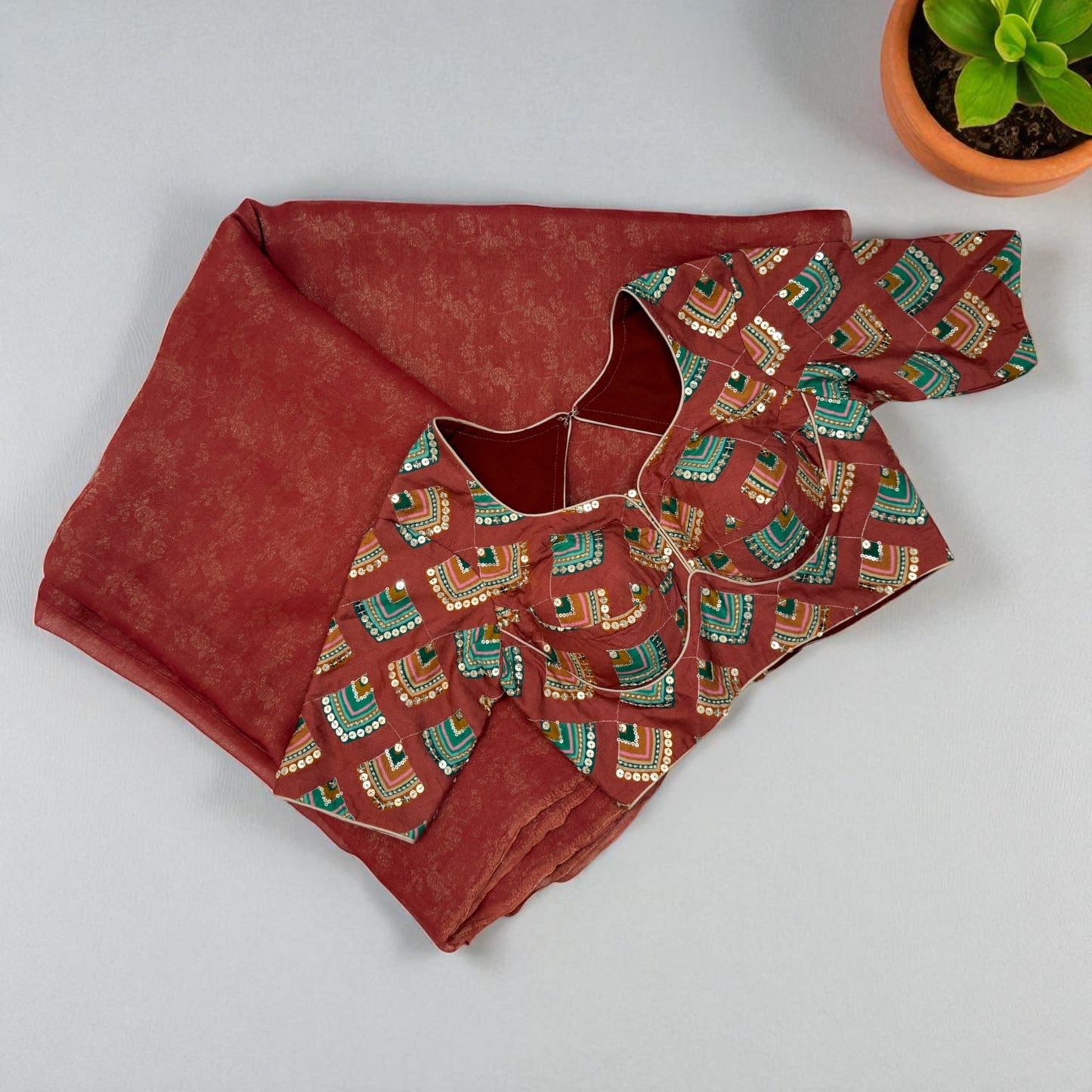 Brick Orange Tissue Saree with Geometric design sequence Blouse