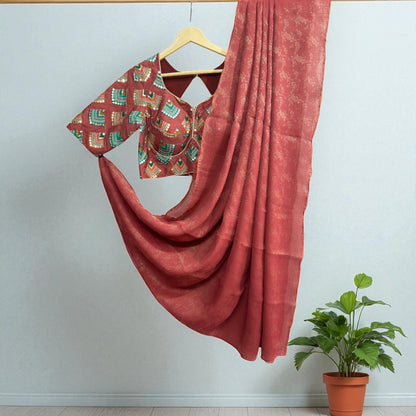 Brick Orange Tissue Saree with Geometric design sequence Blouse